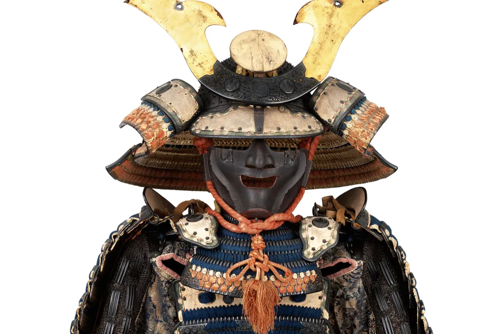 OPENER DETAIL - This suit of  armor bears the crest of the powerful Ikeda family. The helmet dates to the 14th century, and the suit—including the bear-fur shoes—dates to the 18th.