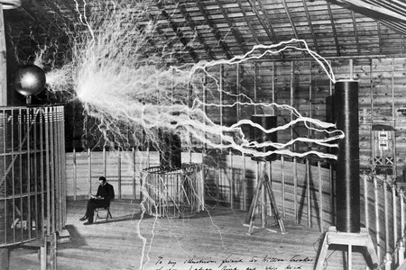 The inventor at rest, with a Tesla coil (thanks to a double exposure).