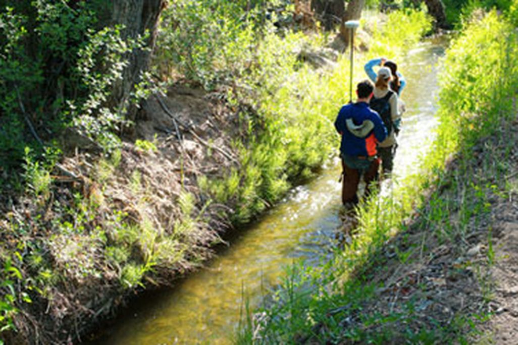 Drylands design students walking a ditch in the Embudo Valley