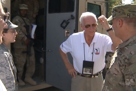 Apollo astronauts travel to meet U.S. soldiers in Afghanistan. 