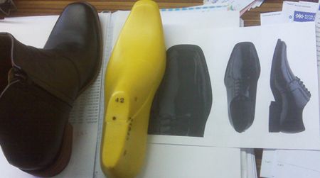 A sample elevator boot, graphic models, and the last on which it was made