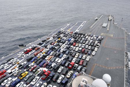 120109-N-EE987-022  SAN DIEGO (Jan. 9, 2012) The aircraft carrier USS Ronald Reagan (CVN 76) transports Sailors??? vehicles while transiting the Pacific Ocean to Naval Base Kitsap, during its homeport change for scheduled Dock-Planned Incremental Availability maintenance. (U.S. Navy photo by Mass Communications Specialist 3rd Class Shawn J. Stewart/RELEASED)