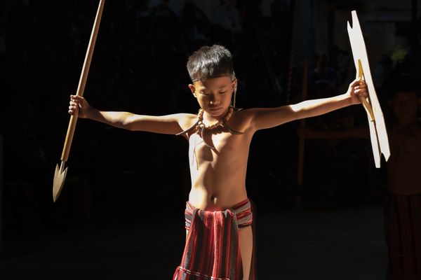 A boy performing a traditional war dance thumbnail