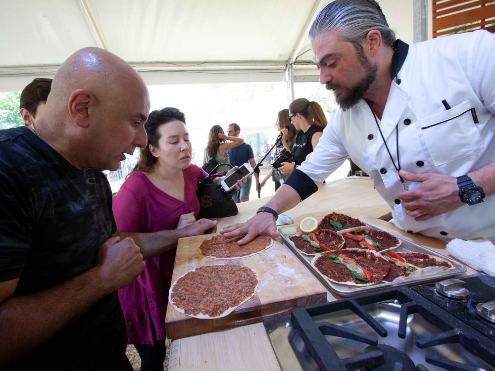 Anto Kilislian prepares lahmajoun at the 2018 Smithsonian Folklife Festival. (Photo by Sonya Pencheva, Ralph Rinzler Folklife Archives)