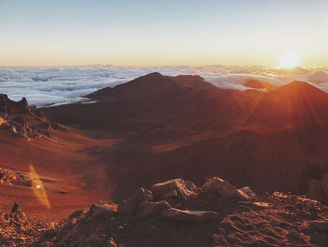 A view of the sunrise above  Haleakala s volcano  crater 