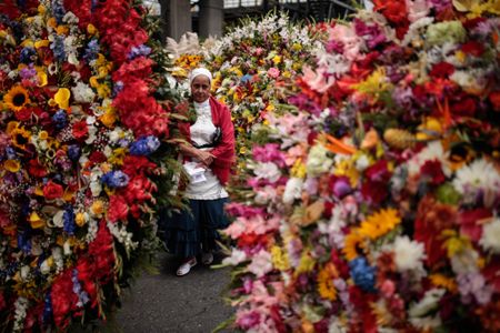 A woman waits to participate in the annual silleteros' parade.