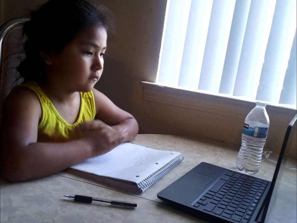 A Diné child begins her much-anticipated school year online in Albuquerque, New Mexico. (Courtesy of Cornillia Sandoval, used with permission)