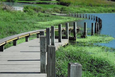 A winding walkway from Mary Miss&#39;&nbsp;Greenwood Pond: Double Site&nbsp;in 2014