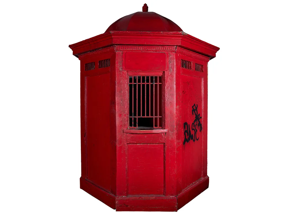Red ticket booth with octagonal roof