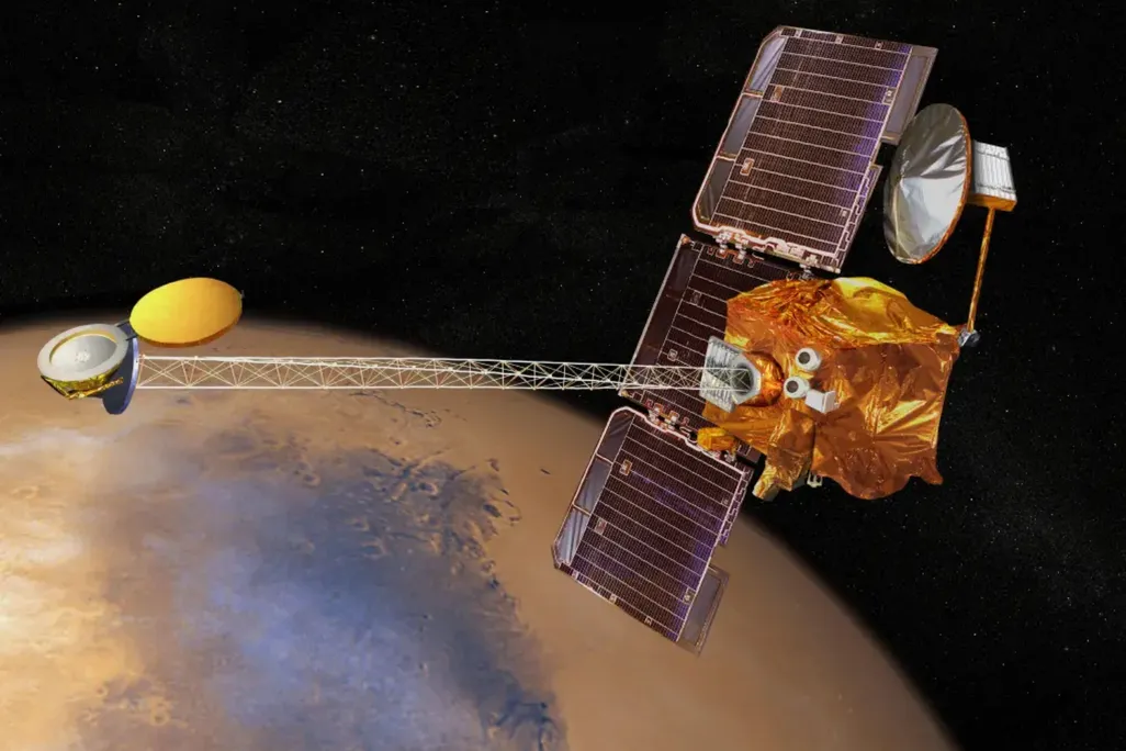 An artistic rendering of the Odyssey spacecraft in orbit over Mars.