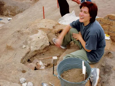 "It's a plastered skull!" shouted anthropologist Basak Boz (with the artifact). To researchers, who have documented more than 400 human burials at Catalhoyuk, the find is evidence of a prehistoric artistic and spiritual awakening.