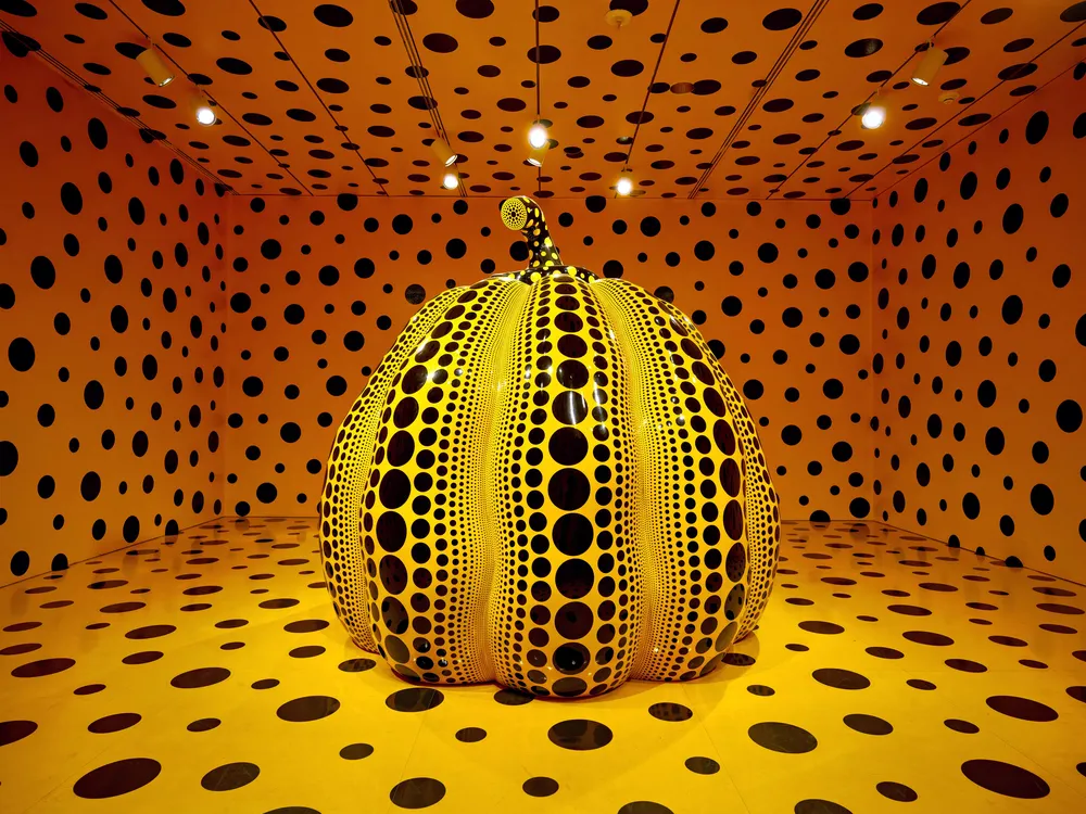 A large pumpkin sculpture by Yayoi Kusama, on view at the Smithsonian's Hirshhorn Museum and Sculpture Garden in 2023