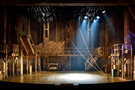 David Korins' striking design—involving a double turntable, a second level catwalk, scaffolding and ropes, calls to mind the ships that brought the Founding Fathers to America.