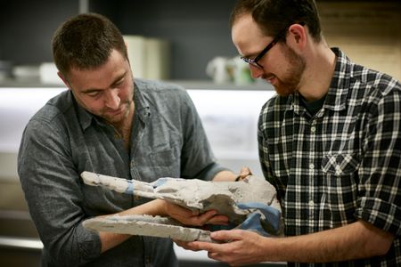 Erich Fitzgerald and Tim Ziegler with a 3D model of Alfred's skull.