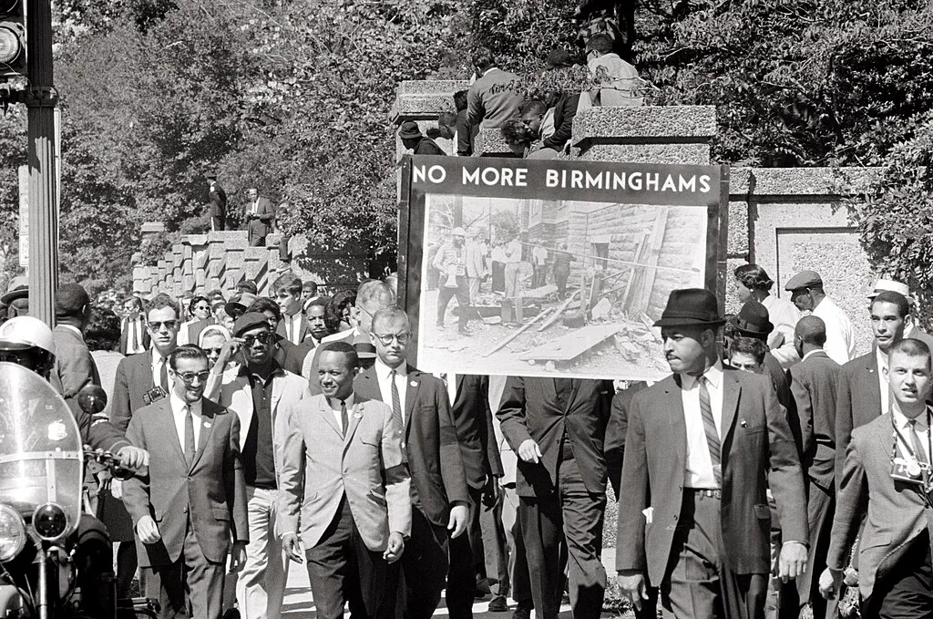 Members of the Congress of Racial Equality and the All Souls Church march in memory of the 16th Street Baptist Church bombing victims on September 22, 1963.