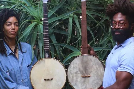 Black Banjo Reclamation Project founders Hannah Mayree and Carlton “Seemore Love” Dorsey, with banjos made by Brooks Masten of Brooks Banjos in Portland, Oregon.