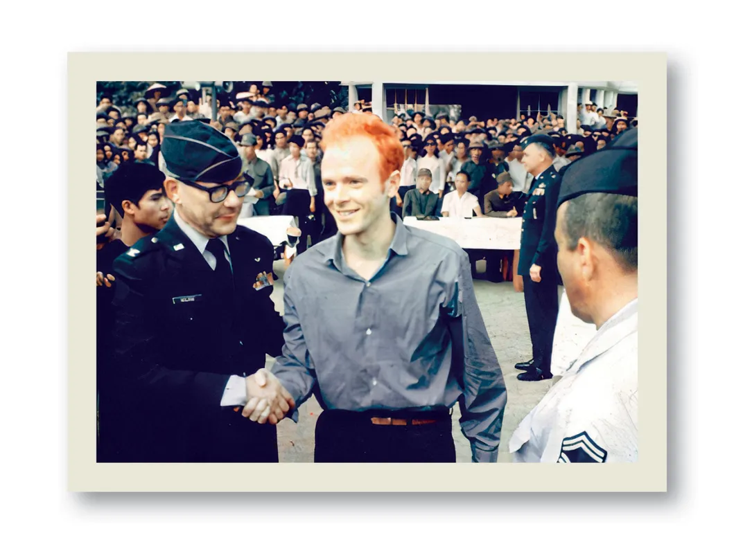 a man shakes hands amongst a crowd of people