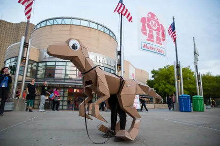 An open source cardboard dino from KitRex stands outside the New York Hall of Science during the World Maker Faire in September 2014.