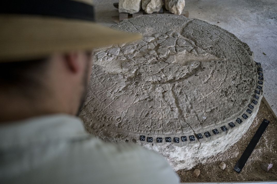 Adrian Chase prepares Altar 21 for a 3D scan. The glyphs record Caracol’s victory over nearby Tikal in 562.