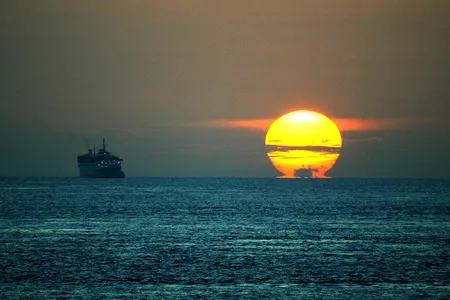 Sunrise over the Straits of Malacca. 
