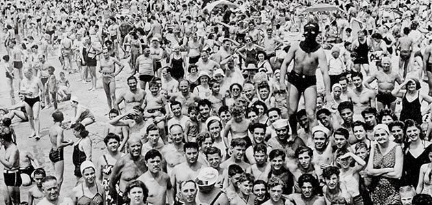 Weegee photo of masked man on Coney Island