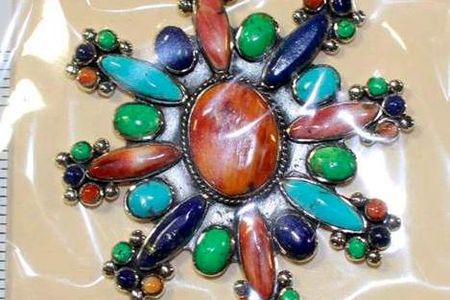 Undated photo provided by U.S. Fish and Wildlife Service shows fake Native American styled-jewelry seized by federal officials during a 2015 investigation in New Mexico.