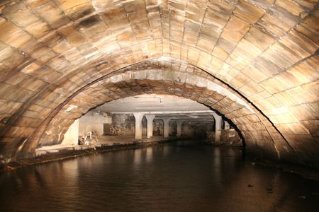 An 800-year-old medieval bridge spans the subterranean River Roch beneath Rochdale, England.