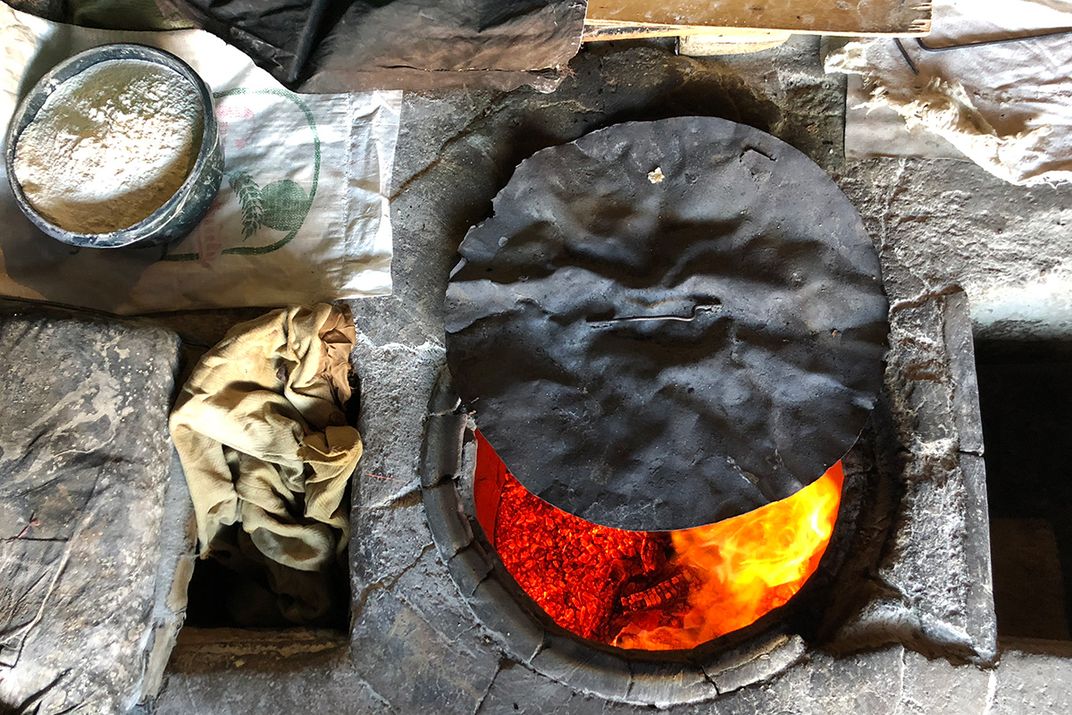 Before making lavash, the women of the bakery in Argel first let the fire burn down to allow for more even heat.