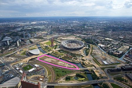 An aerial view shows the location of the culture and university district, a 4.5-acre triangular site, near the London Aquatics Centre, the former Olympic Stadium and the ArcelorMittal Orbit sculpture and observation tower.