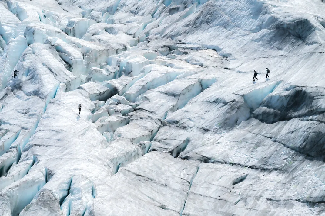 Adventurers ascend the 5,900-foot Fee Glacier