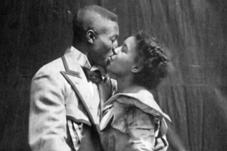 Saint Suttle and Gertie Brown embrace in the 1898 film 'Something Good-Negro Kiss.'