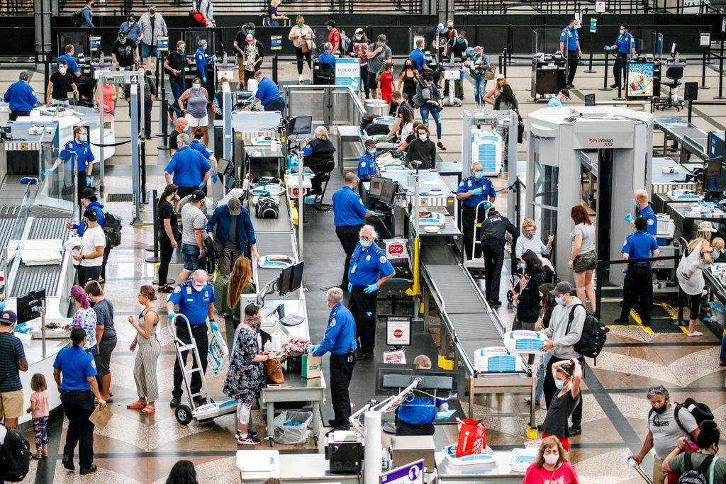 Passengers going through security at Denver airport