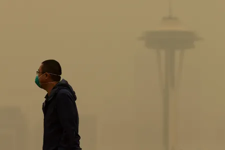 A man in Seattle wears a mask as wildfire smoke descends on the city in September of 2020.