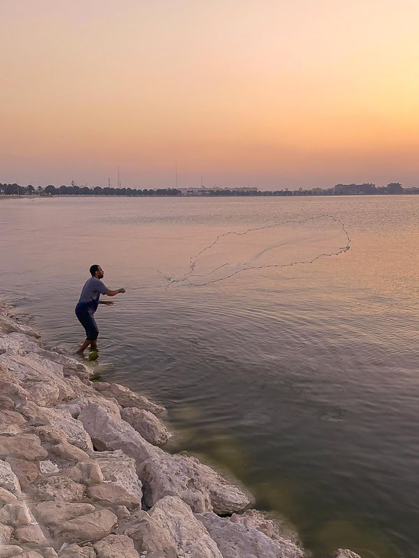 A man with a fishing net thumbnail