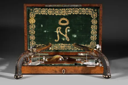 The weapons are adorned with gold and silver designs and an engraved image of&nbsp;Napoleon.