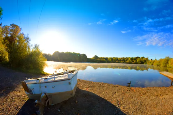 A shored up boat on a local lake thumbnail