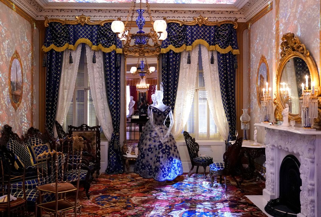 A period room staged by film director Janicza Bravo, featuring fashions by designer Marguery Bolhagen, in the Met's "In America: A Lexicon of Fashion" exhibition