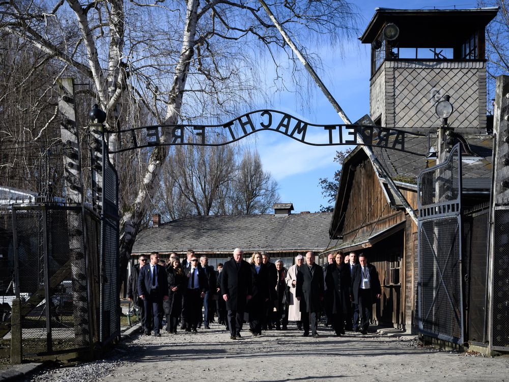 Group of people walking under a gate