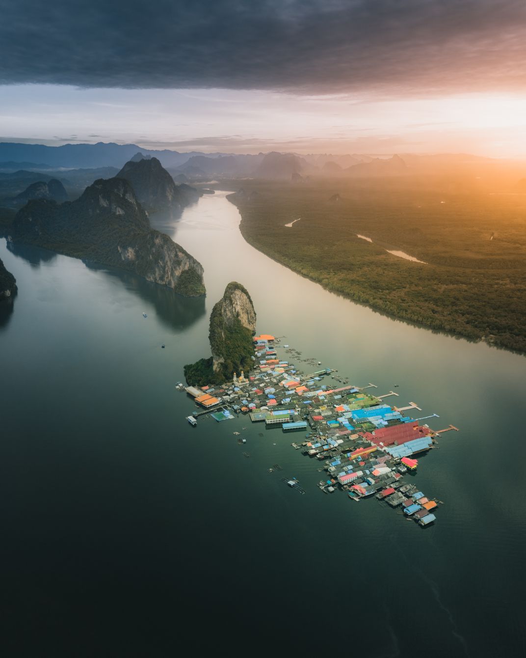 6 - The sun rises over a floating village on Panyee Island in Thailand’s Phang Nga Bay.