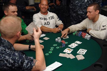 A game of Texas hold 'em in progress. "Hold 'em" is a popular form of poker.