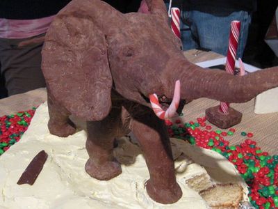A chocolate model fo the African Bush elephant in the rotunda of the Smithsonian's National Museum of Natural History on top of a festive holiday cake.