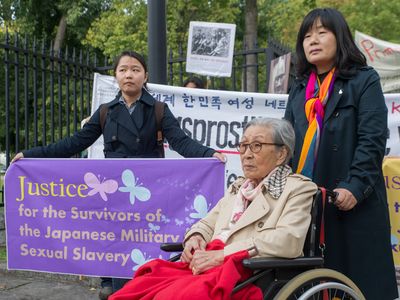 An 89 year-old Korean 'comfort woman' Kim Bok-Dong protests in front of the embassy of Japan in Berlin to demand an official apology from Japan in September, 2015.