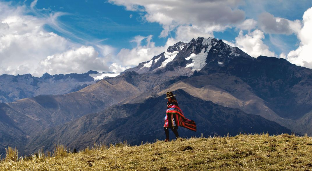 Andean woman walking near Chinchero. Credit: Christopher Newman