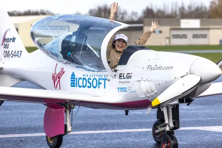 Zara Rutherford greets reporters at&nbsp; Wevelgem International Airport on January 20, 2022 in Kortrijk, Belgium. At age 19, she became the youngest female pilot to circumvent the globe, traveling across five continents in five months while flying in a single-seater sport plane.