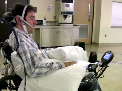 Paralyzed patient Jason Disanto navigates through a room full of obstacles by guiding the wheelchair with his tongue.
