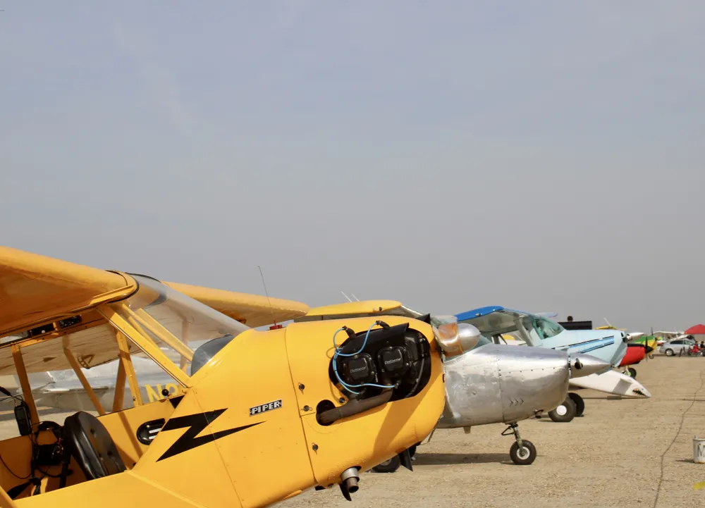 Piper J-3 Cub, Several Cessnas and a Veri Eze, on the flight line at Shafter Minter Field (KMIT) in California during Wings and Wheels 2023.