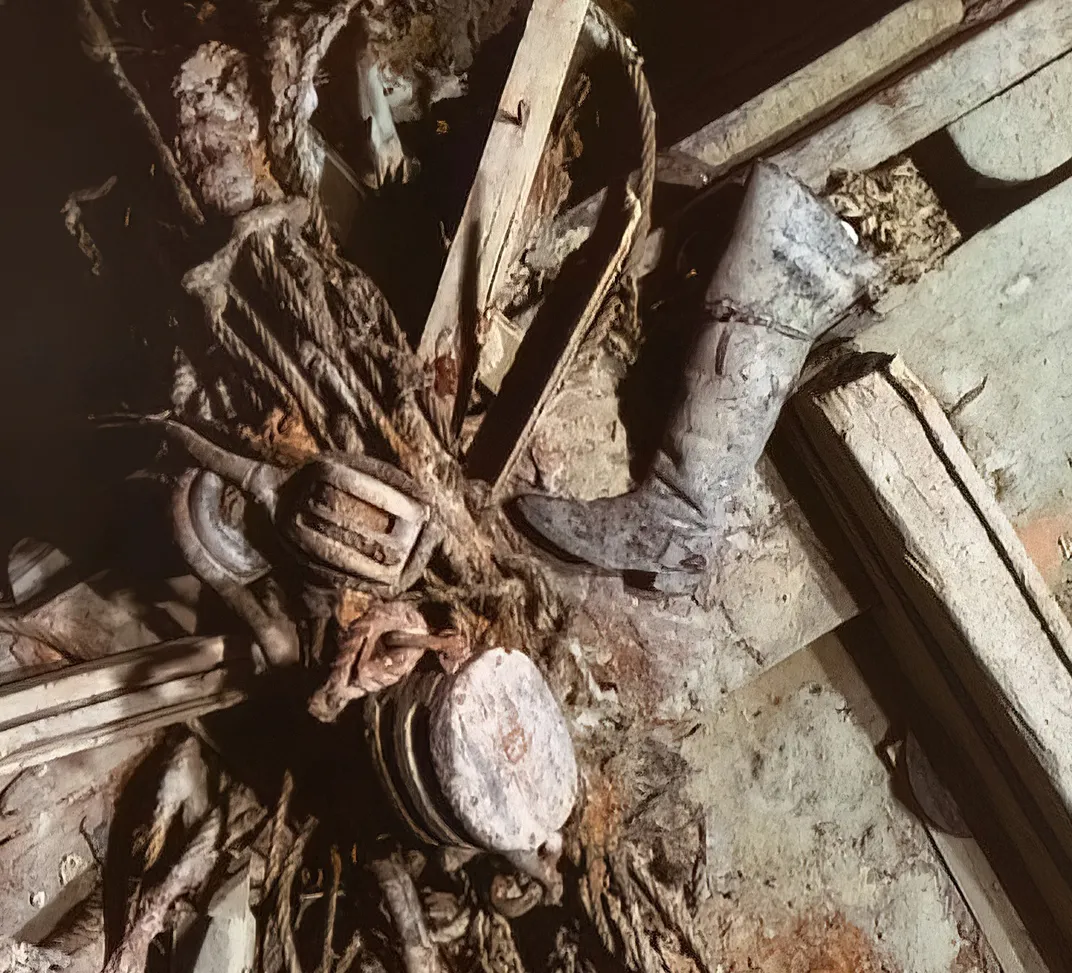 Underwater wreckage of shipwreck with a boot visible