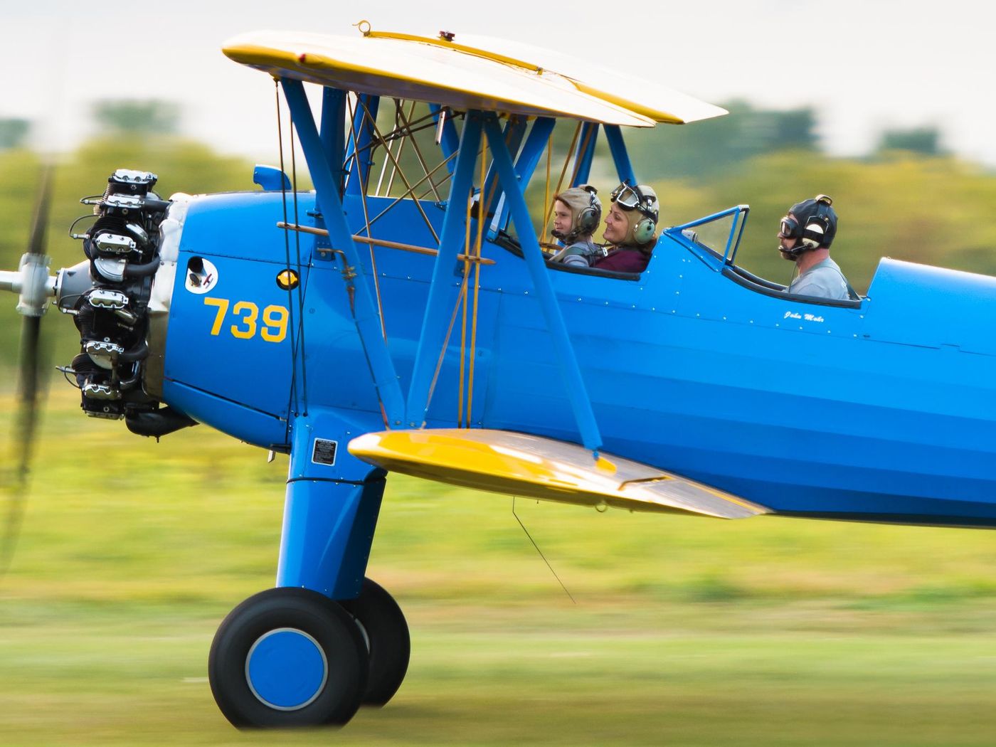 people in a blue aircraft
