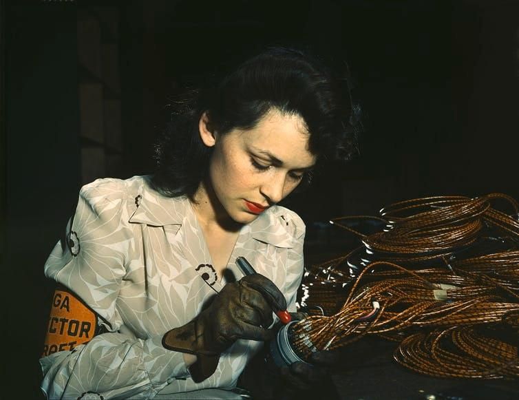 Worker at Vega Aircraft Corporation in Burbank checks electrical assemblies.