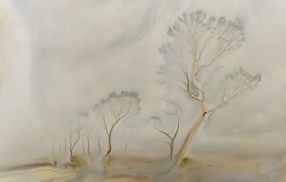 The tide marks along the riverbank after the ebb tide are like a painting.